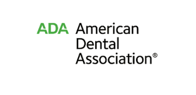 Logo featuring "ADA" in green alongside "American Dental Association" text. Simple and professional design on a black background.